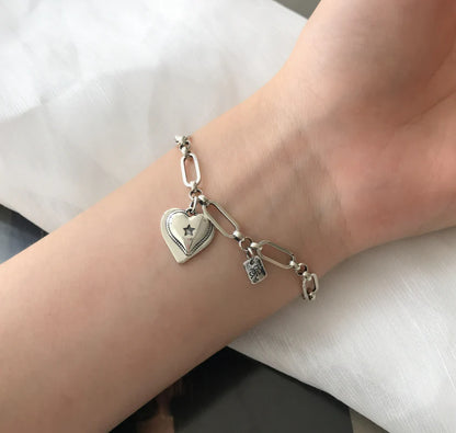 Handcrafted 925 sterling silver bracelet with a delicate heart design, a timeless and elegant accessory for Kiwi women.