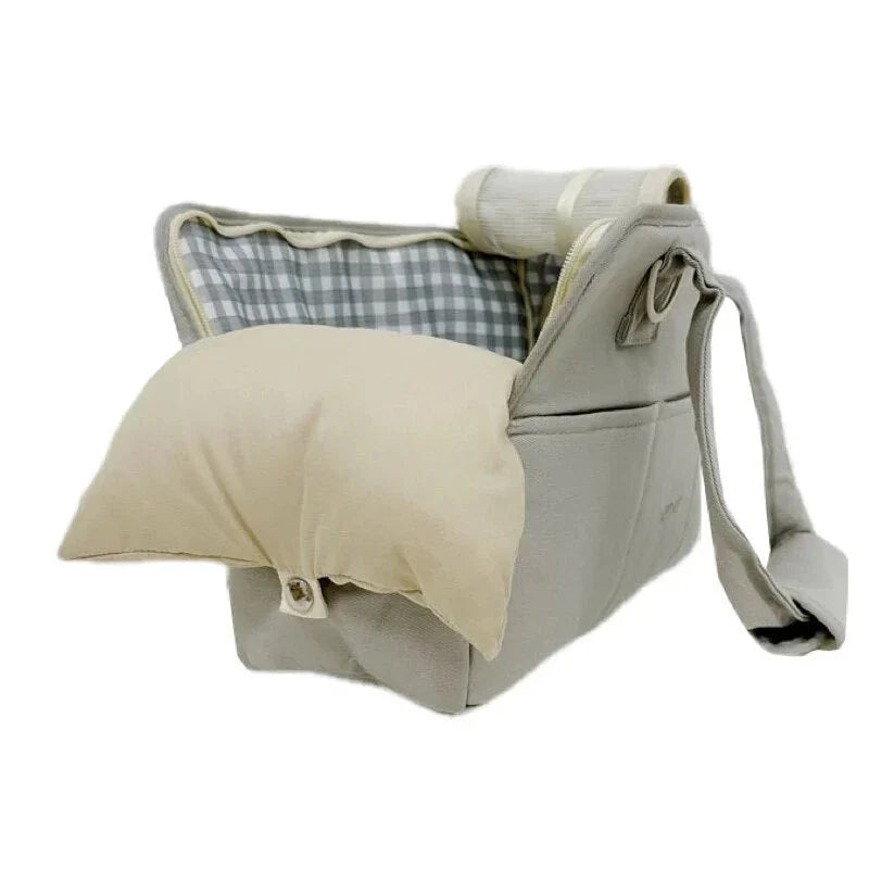 A stylish and practical cotton shoulder bag carrier for small dogs, with a hard board base and cozy interior for comfort and security during adventures.