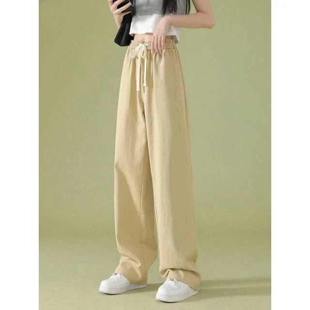 Elegant high waist wide leg pants in a versatile white color, perfect for the modern Kiwi woman's wardrobe.