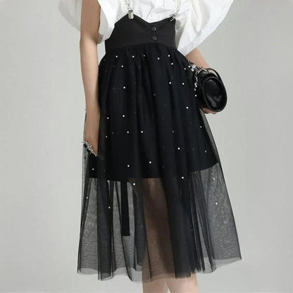 Stylish Dot Mesh Midi Skirt in black, featuring an asymmetrical silhouette and delicate dot mesh overlay