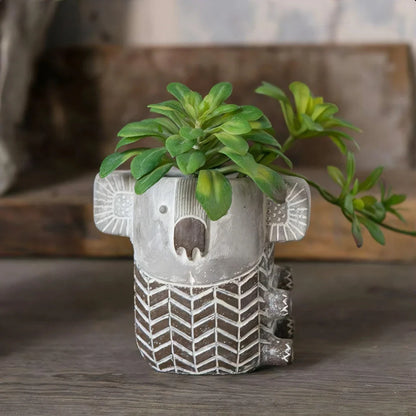 Charming kiwi-inspired koala-shaped cement planter for displaying succulents, small flowers, or as a decorative piece