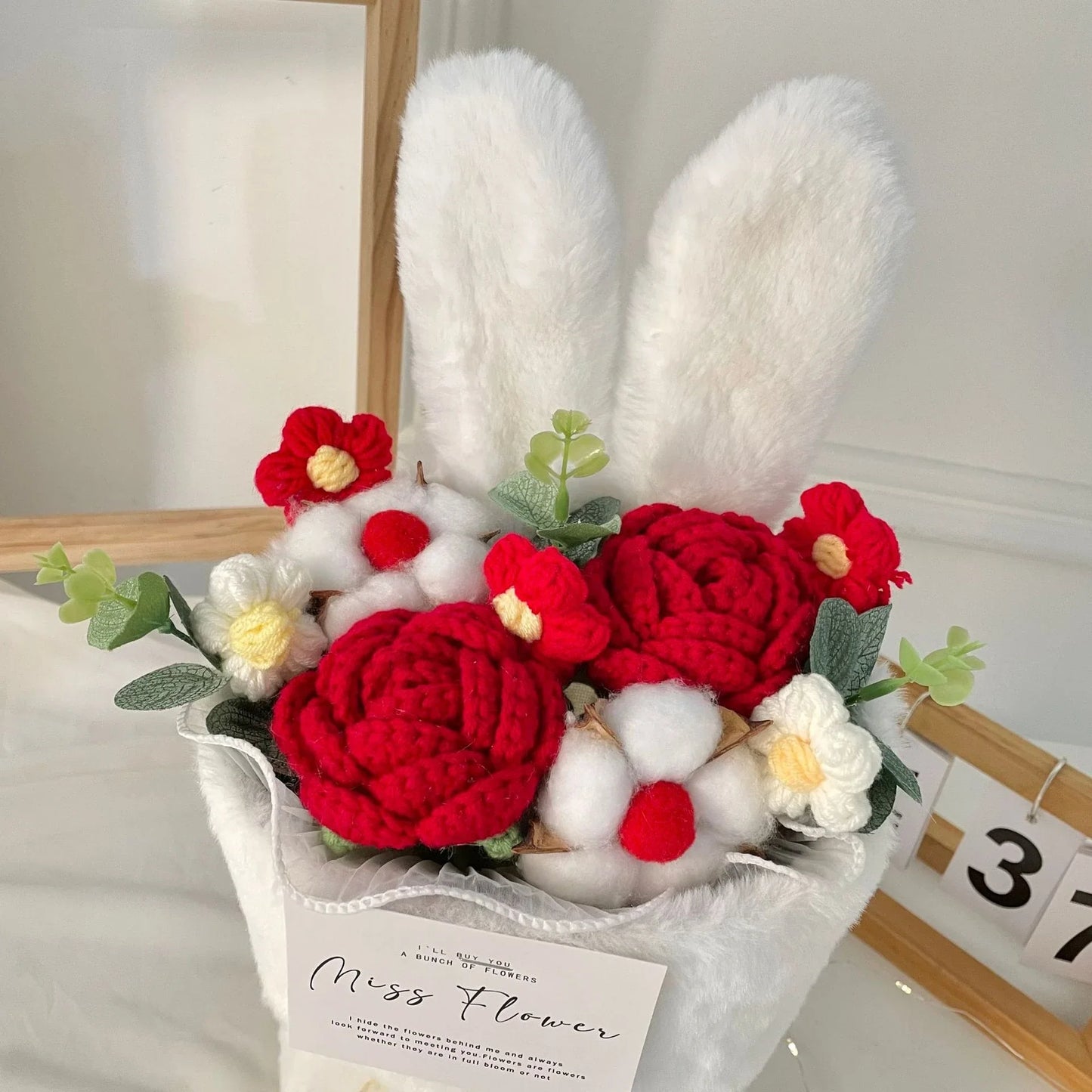 Creative knitted rabbit ear bouquet doll in vibrant colours, a unique and eco-friendly home accessory from New Zealand