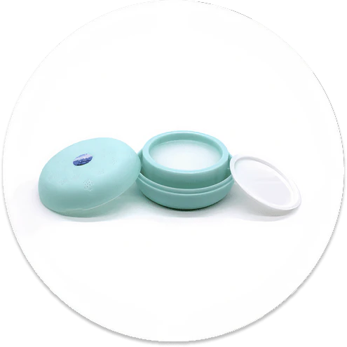 Macaron-shaped car air freshener with floral-shaped fragrance outlets and a sticker base for easy dashboard attachment