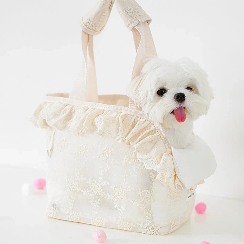 Stylish and comfortable puppy carrier bag made of lightweight nylon with a floral lace design, perfect for carrying small dogs on summer outings.