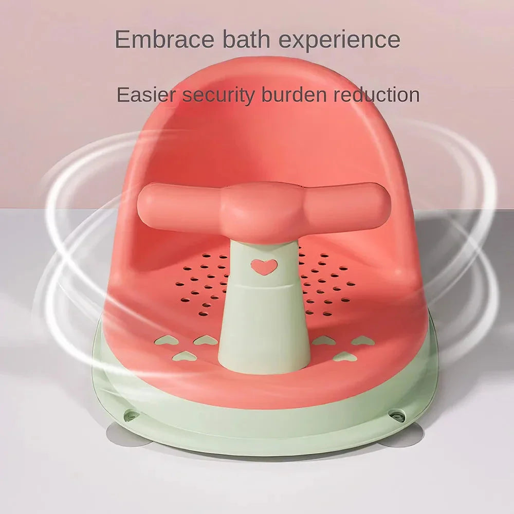 A green, ergonomically designed infant bath tub with large suction cups on the bottom to prevent slipping or tipping.