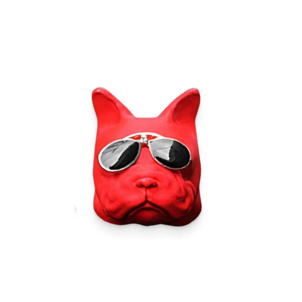 Vibrant red car air freshener in the shape of a bulldog with painted aviator shades and collar