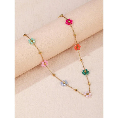 Vibrant, colorful flower-beaded stainless steel bracelet with adjustable chain and link design