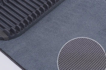 A modern, gray dish drying rack with convenient storage space for kitchen essentials, designed to declutter and streamline your Kiwi kitchen