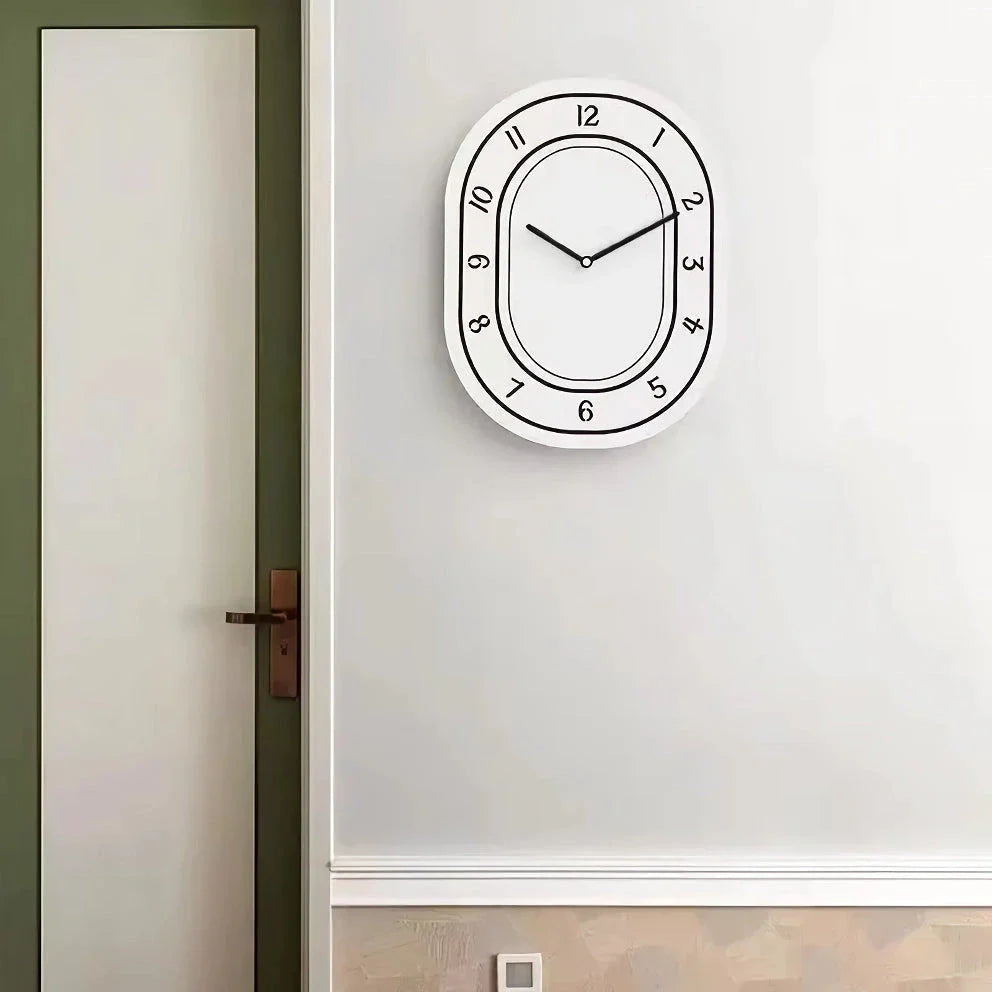 A minimalist, white wall clock with a clean design that adds a touch of modern sophistication to any Kiwi home.