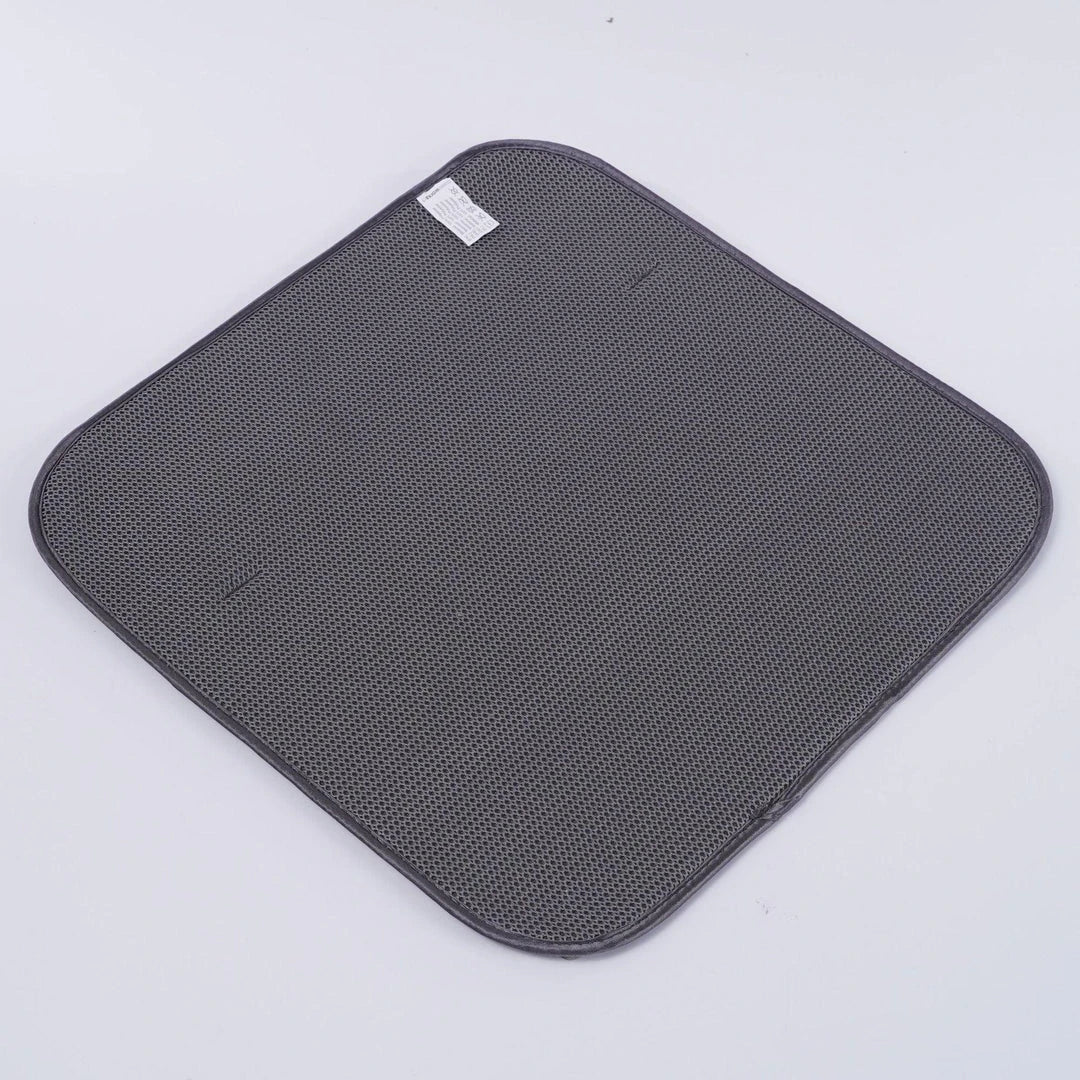 A modern, gray dish drying rack with convenient storage space for kitchen essentials, designed to declutter and streamline your Kiwi kitchen