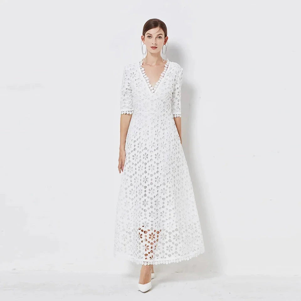 A white lace maxi dress with a stylish V-neck design, perfect for special occasions.