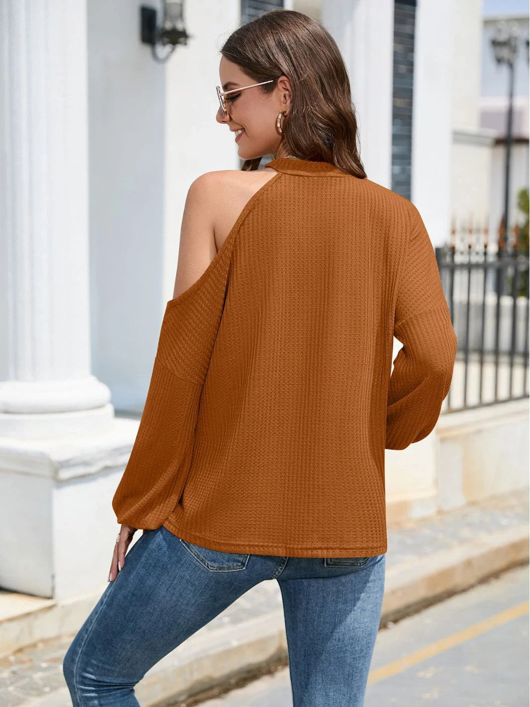 A stylish off-the-shoulder top with long lantern sleeves and a crew neck, available in a variety of classic Kiwi-inspired colours.