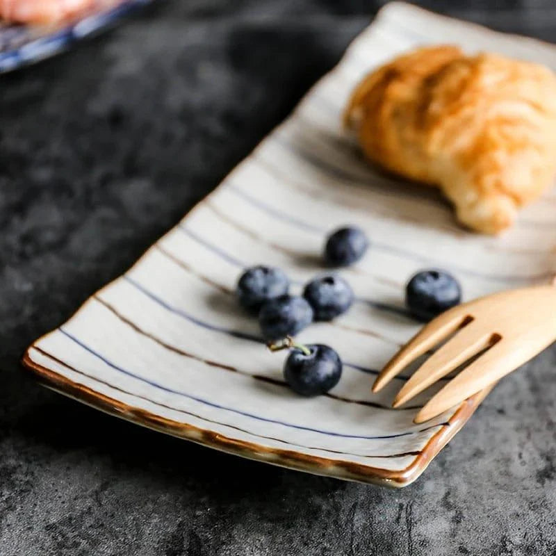Beautifully crafted Japanese-inspired ceramic plate with a blue and orange glazed finish, perfect for Kiwi homes