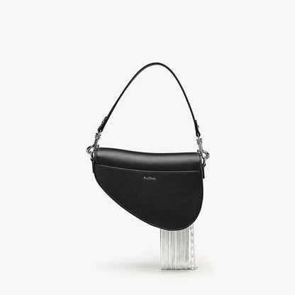 Stylish leather crossbody saddle bag with trendy tassel detail, perfect for everyday use or formal occasions