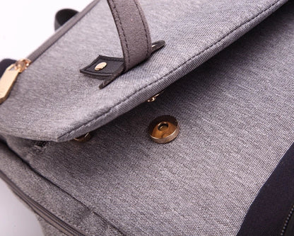 Versatile Mummy Daddy Backpack in Grey, a functional and stylish nappy bag for Kiwi families with a spacious main compartment, insulated pockets, and a USB charging port.