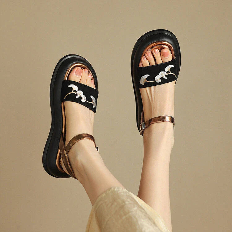 Embroidered platform sandals with kid suede upper and durable TPU outsole, designed for everyday comfort and style.