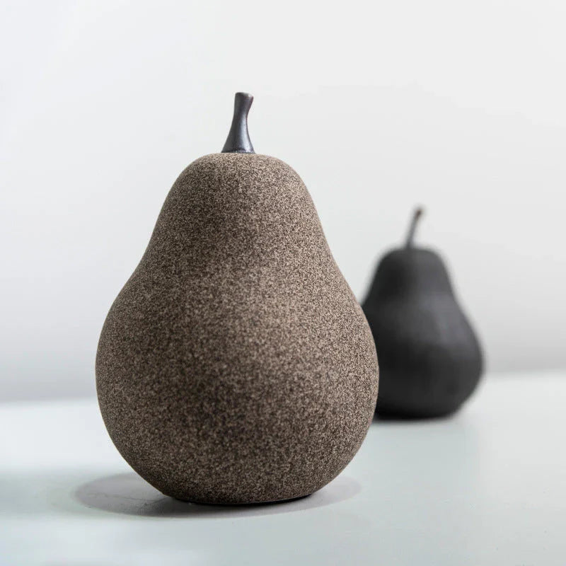 Handcrafted ceramic pear decoration with a sleek, modern design, perfect for adding a touch of natural elegance to any Kiwi home