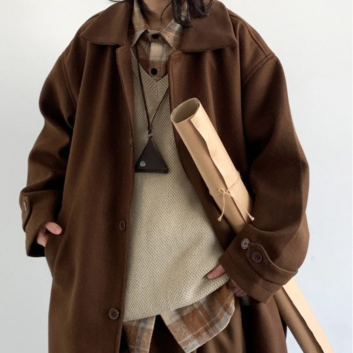 Premium woollen coat in a retro Japanese-inspired style, with a relaxed fit and earthy tones perfect for the Kiwi winter.