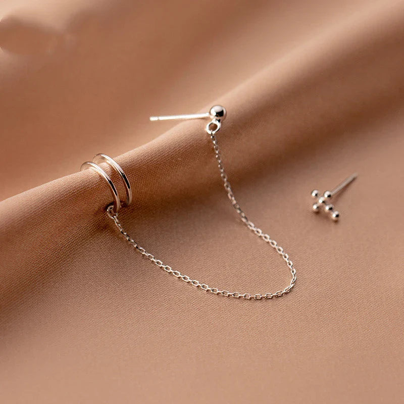 Unique one-piece sterling silver earring and ear clip set designed by New Zealand artist Xia Chunyin