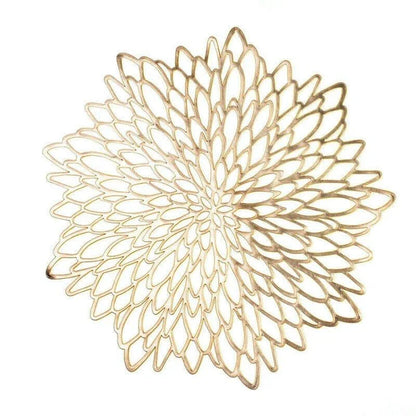 Flower-shaped PVC placemat in gold color, adding natural beauty and elegance to a dining table setting.