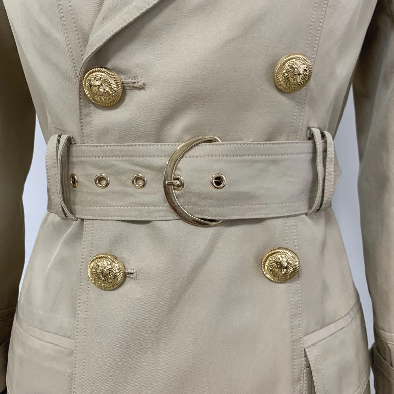 A stylish double-breasted trench coat with a belted waist, made from a cotton-polyester blend for durability and comfort.