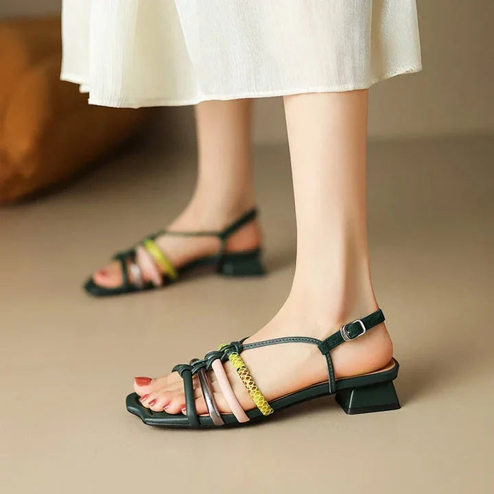 Vibrant Roman-inspired sandals with chunky heel, showcasing a stylish and comfortable summer footwear option