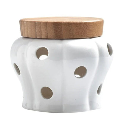 Stylish white ceramic garlic storage jar with wooden lid, designed for modern Kiwi kitchens