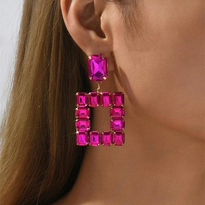 Stunning transparent crystal earrings in a variety of colours, including rose red, green, pink, champagne, white, and black.