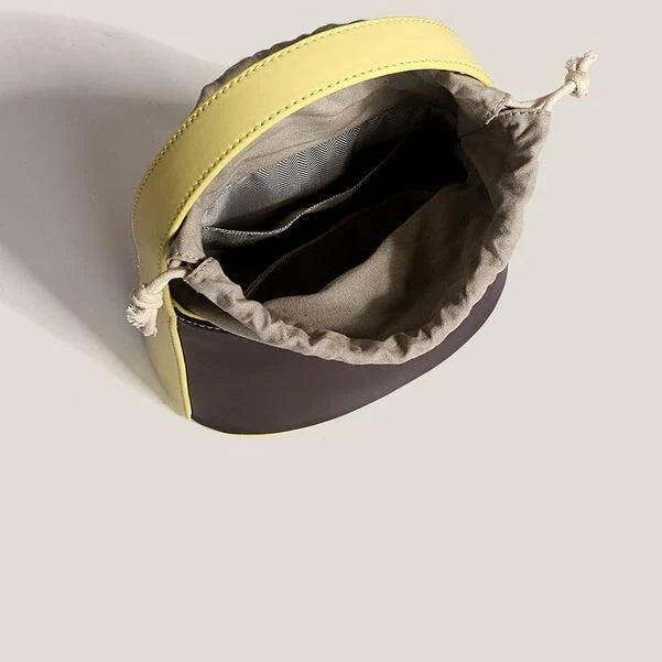 Stylish vegan leather colour block bucket bag with adjustable strap, perfect for modern Kiwi lifestyles