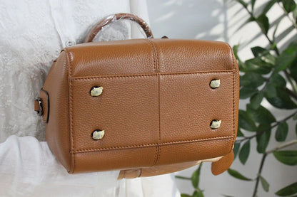 Classic leather shoulder bag in brown with a soft, pillowy shape and cotton lining for ultimate comfort and style