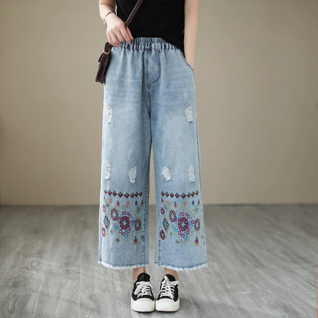 Embroidered denim jeans with distressed details, perfect for the modern Kiwi lifestyle