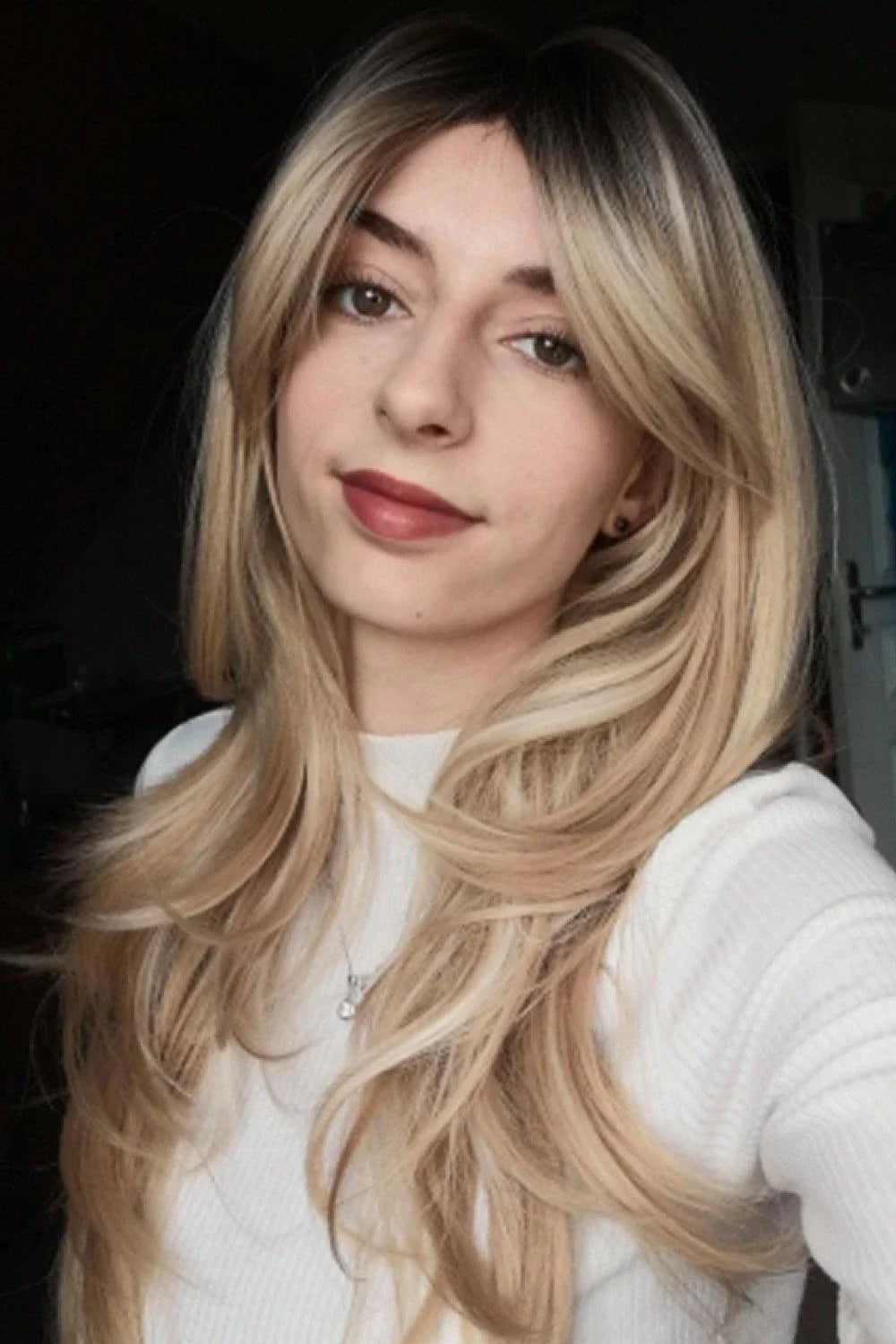 Stylish mid-length wave synthetic wig in cream color with comfortable cap construction and heat-safe synthetic fibres