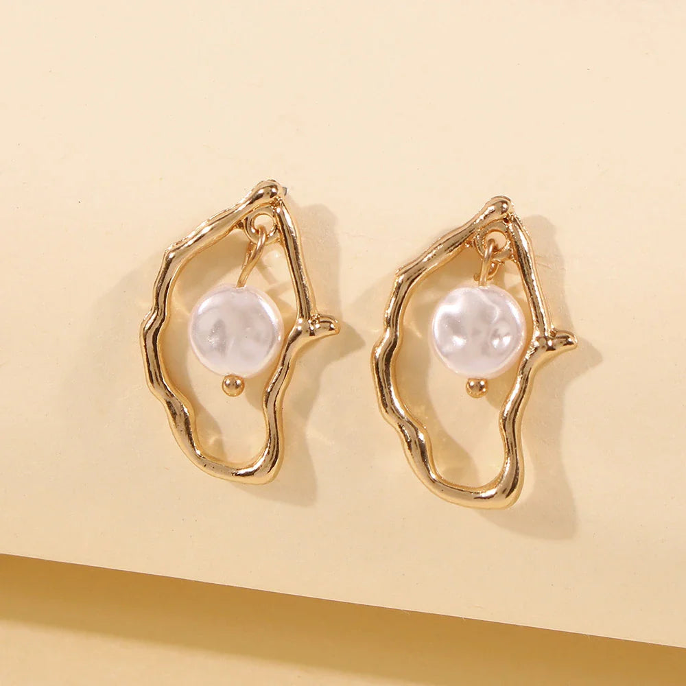 Irregular shaped pearl earrings made with sustainable alloy material, perfect for the free-spirited Kiwi