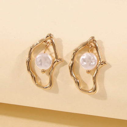 Irregular shaped pearl earrings made with sustainable alloy material, perfect for the free-spirited Kiwi