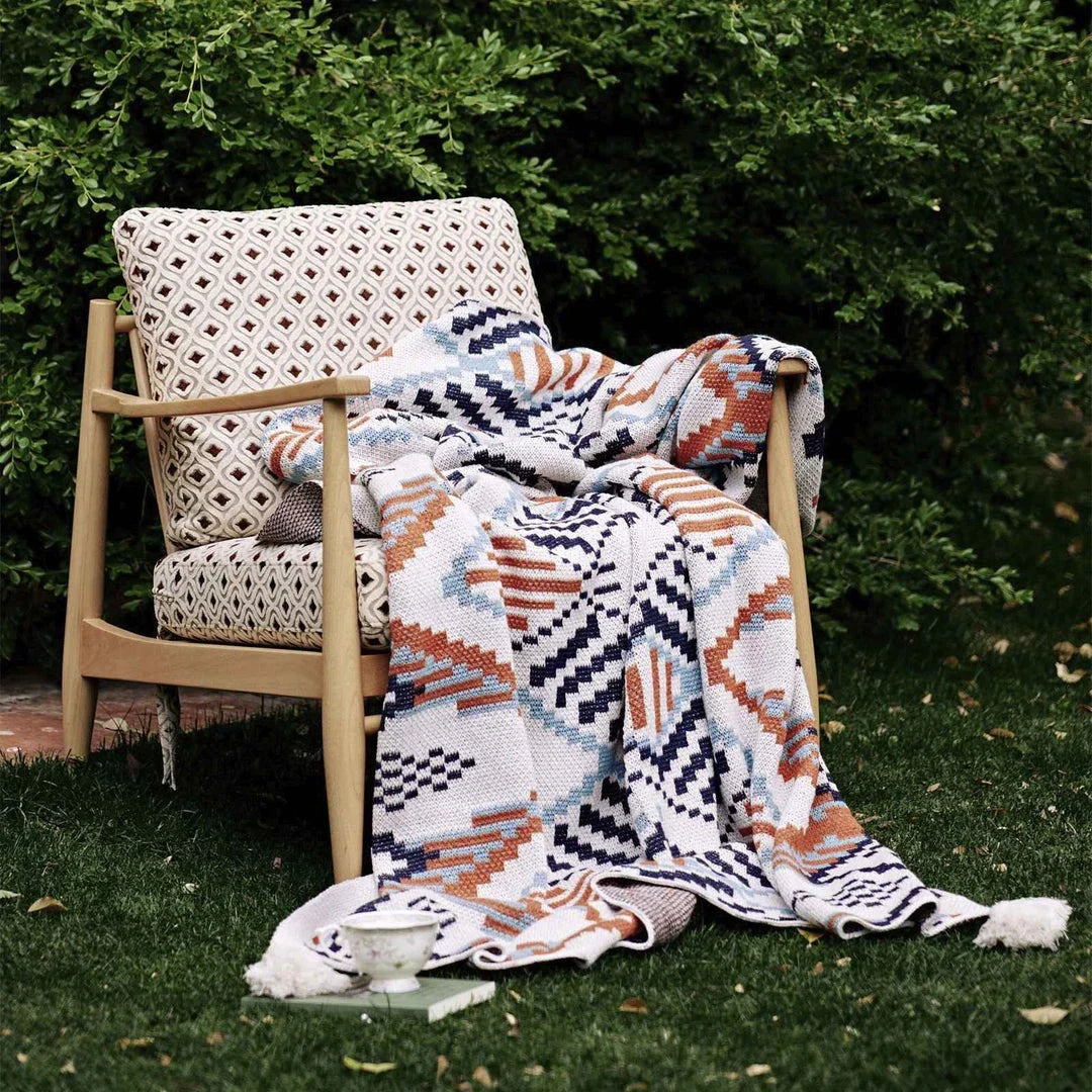 Cozy boho geometric cotton blanket in multicolor design, perfect for adding style and comfort to Kiwi homes and outdoor spaces