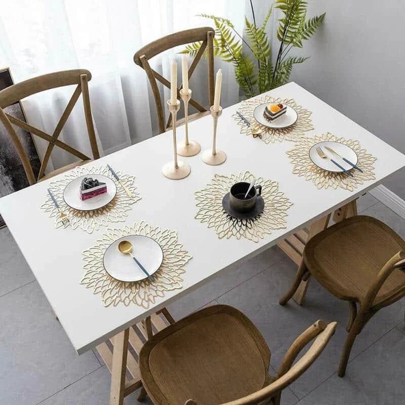 Flower-shaped PVC placemat in gold color, adding natural beauty and elegance to a dining table setting.