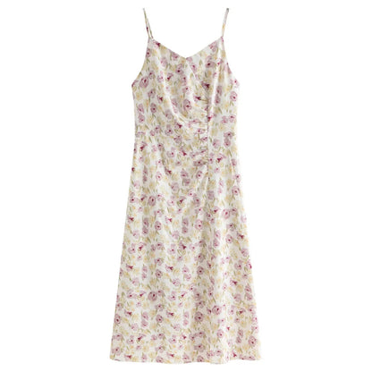 Summery floral suspender dress with spaghetti straps, V-neckline, and pencil silhouette, perfect for romantic summer occasions.