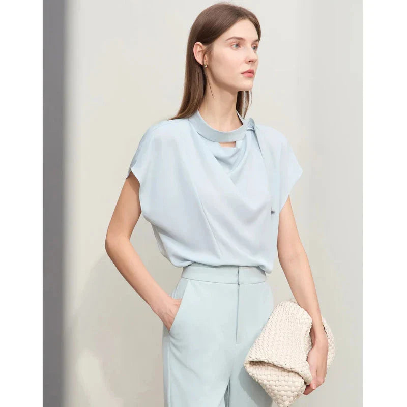 Minimalism Summer Solid Women's Blouse in Blue, featuring a loose swing neck, tie sleeves, and hollow-out decoration for a chic, breathable summer office look.