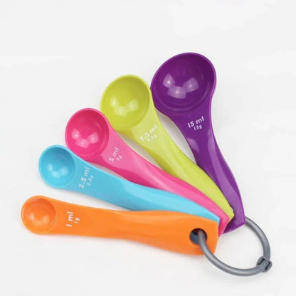 Set of 5 colourful measuring spoons in vibrant shades of red, blue, green, yellow, and orange