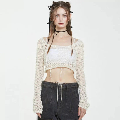 A stylish knitted sweater with hollow-out detailing and tassels, perfect for Kiwi autumn fashion