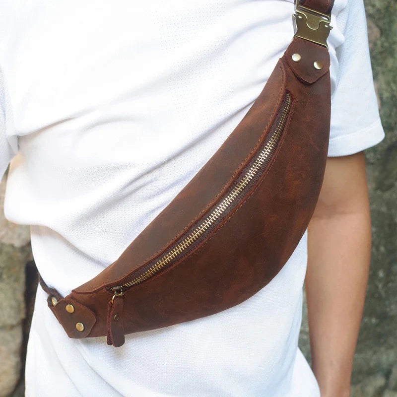 Durable vintage-inspired cowhide crossbody bag with single adjustable shoulder strap, roomy interior, and secure zipper closure