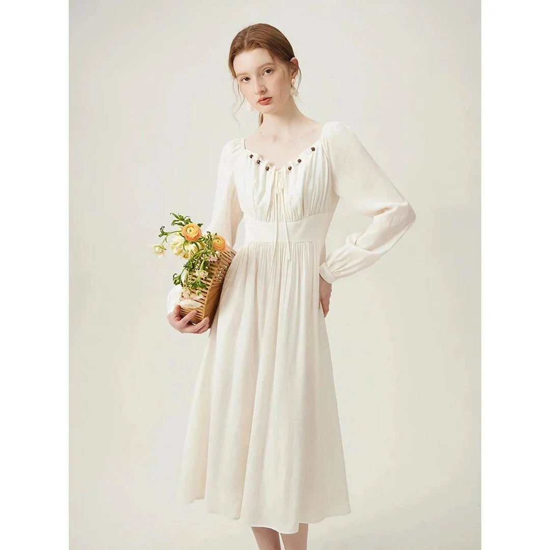 Elegant Kiwi-Inspired Romantic Dress with full-length sleeves, empire waistline, and A-line silhouette