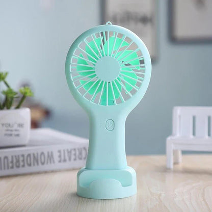 Compact USB-powered mini fan with adjustable speeds and quiet operation, ideal for home, office, and travel use