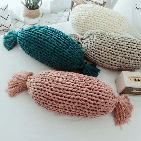 Cosy candy-shaped chunky knit pillow with adorable tassel design, perfect for adding a playful touch to your Kiwi home decor