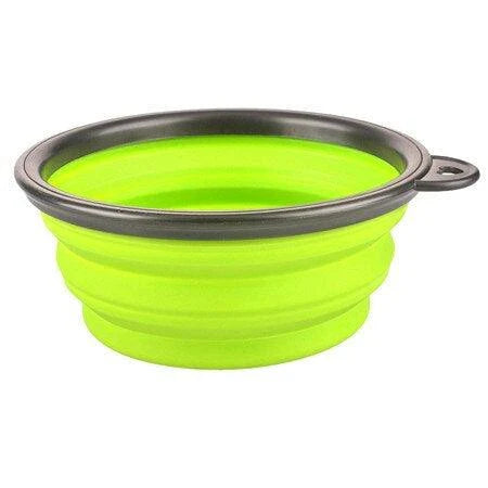 Foldable silicone dog bowl in red color, perfect for outdoor activities with Kiwi canine companions