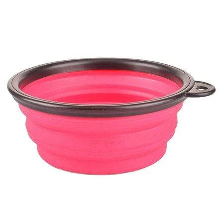 Foldable silicone dog bowl in red color, perfect for outdoor activities with Kiwi canine companions