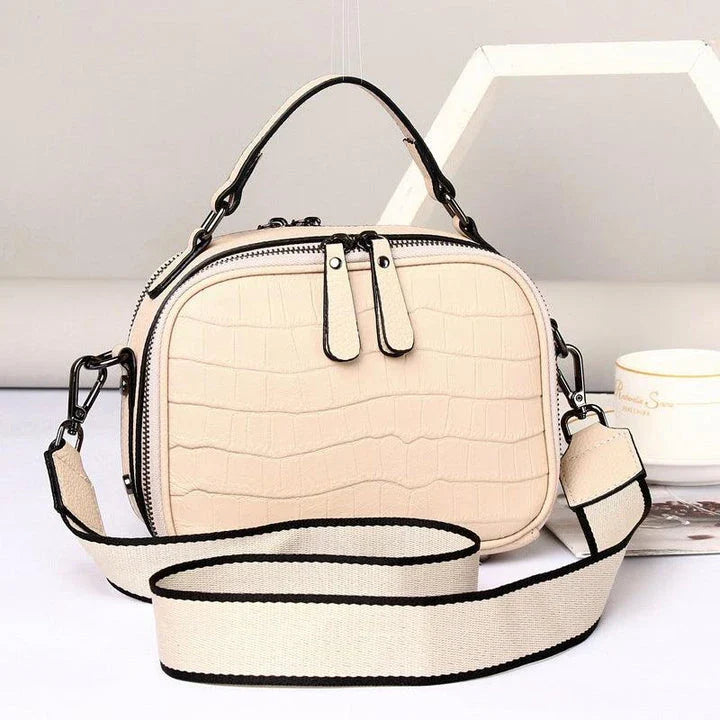 Stylish first layer leather crossbody bag in offwhite color, featuring a trendy square design and multiple interior pockets for Kiwi fashionistas