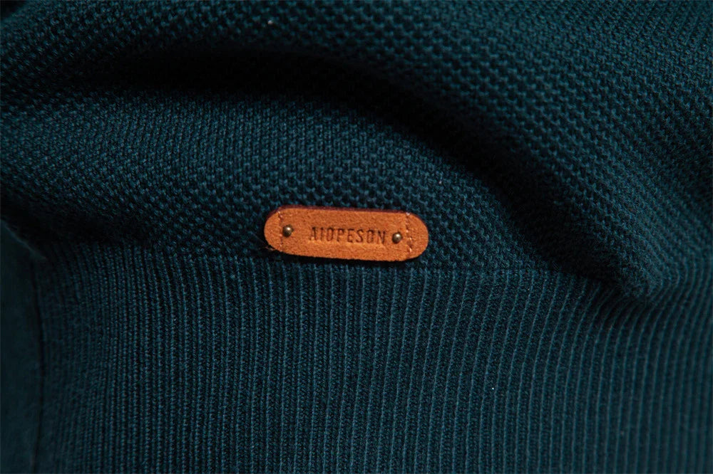 A stylish, slim-fit sweater in a modern colour-blocking design of Lake Green, White, and Grey, made with premium cotton for exceptional comfort and New Zealand casual style.