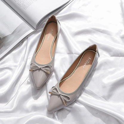 Stylish black pointed toe flats with bow knot and beading detail, perfect for Kiwi fashion