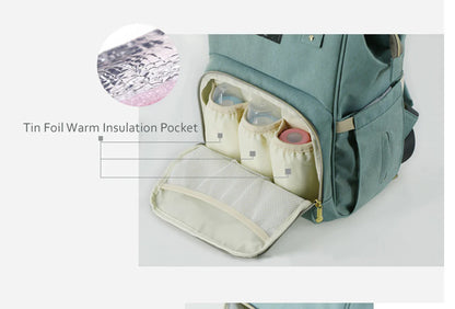 Stylish and practical mummy bag with reinforced handles, durable buckles, and separate bottling area for Kiwi mums